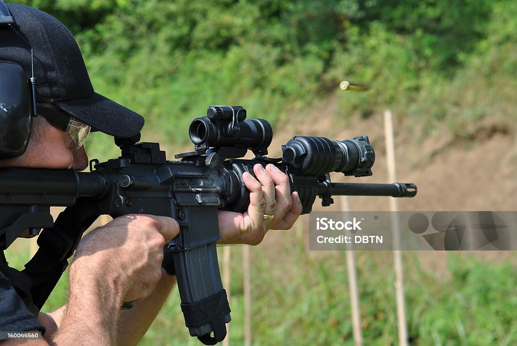 This police SWAT officer practices with his rifle.